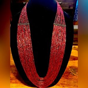Burgundy Necklace. Thirty (30) strand multiple shades of Burgundy Glass Beads.